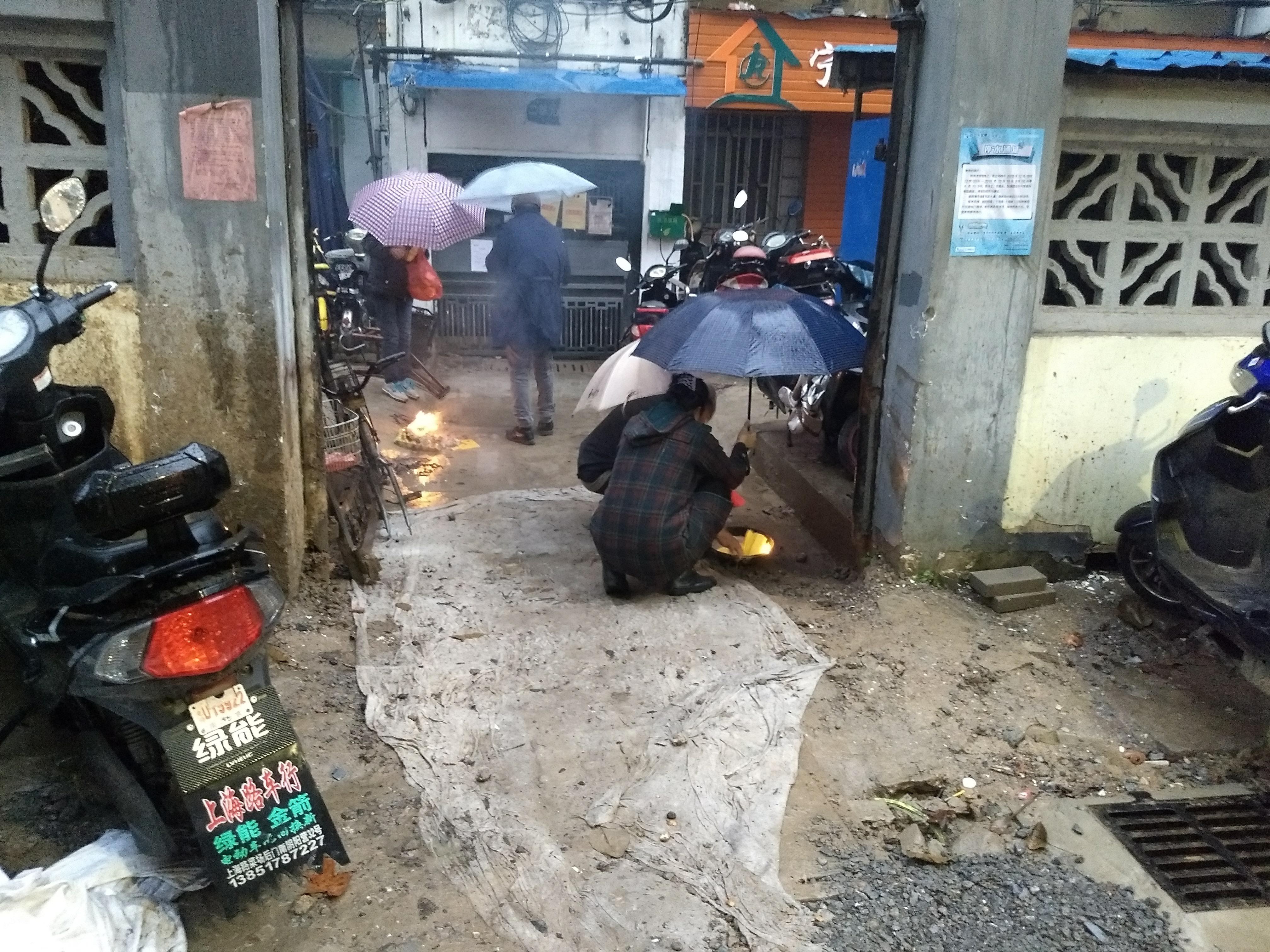 Old people burning joss paper